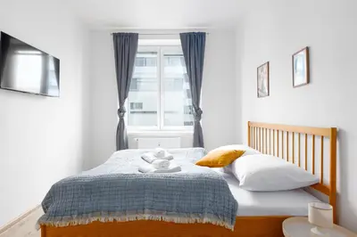a bedroom with a bed with a teddy bear on it at Apartment - 2 bedrooms, kitchen, close to metro in Prague