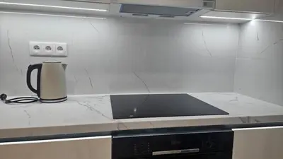 a kitchen counter with a coffee maker on a counter top at Relax Apartment in Prague