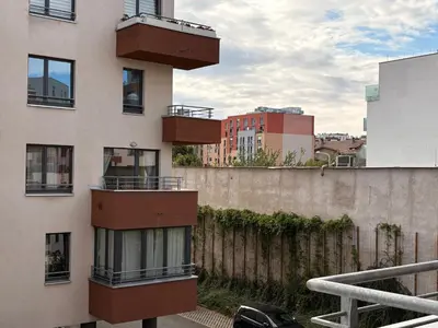 a building with balconies on the side of it at UrbanFlat1615 with Parking in Prague