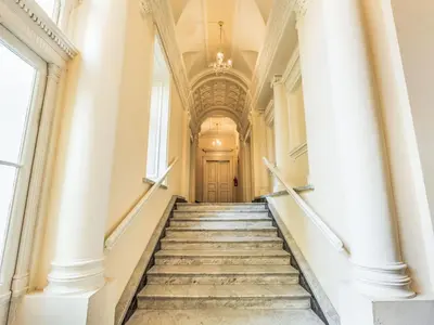 a staircase leading up to a building with a door at Apartment Washington-3 by Interhome in Prague