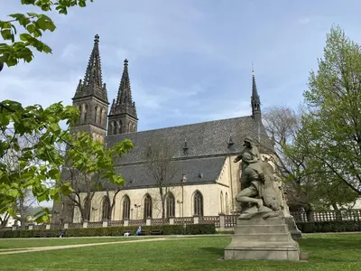 a statue in front of a building with a church at Apartment Washington-3 by Interhome in Prague