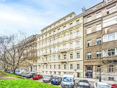 a large building with cars parked in front of it at Apartment Washington-3 by Interhome in Prague