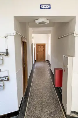 a hallway of an empty room with a door at Studio Art District Nook by Interhome in Prague