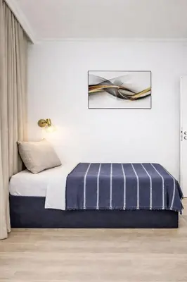 a bedroom with a bed and a picture on the wall at Apartment Washington-2 by Interhome in Prague