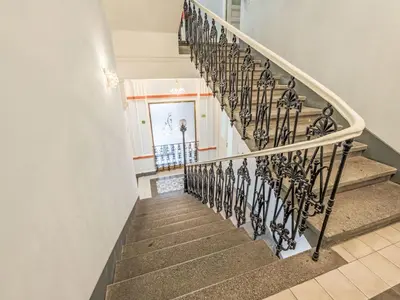 a staircase in a home with wrought iron railings at Apartment Čelakovsky-1 by Interhome in Prague