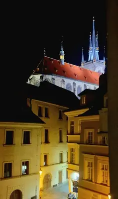 a view of a building with a castle in the background at Tynska apartment in Prague