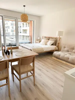 a living room with a bed and a table at Jack apartman , 02 Arena ,PVA Expo, Free parking in Prague