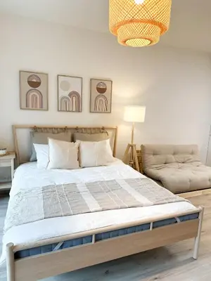 a bedroom with a large bed and a couch at Jack apartman , 02 Arena ,PVA Expo, Free parking in Prague