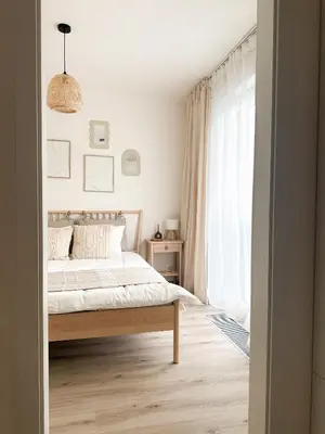 a bedroom with a bed and a large window at Jack apartman , 02 Arena ,PVA Expo, Free parking in Prague