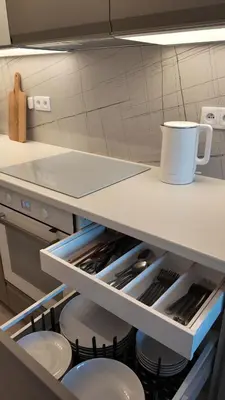 a kitchen with a shelf with pots and pans at Amy apartman , 02 Arena, Free parking in Prague