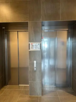 two elevators in a building with their doors open at Amy apartman , 02 Arena, Free parking in Prague