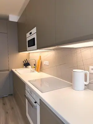 a kitchen with a sink and a microwave at Amy apartman , 02 Arena, Free parking in Prague