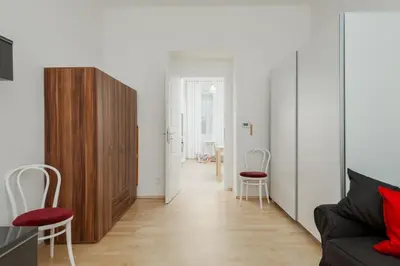 a living room with a couch and two chairs at Sweet Spot for 6 in Trendy Area! Family friendly! in Prague