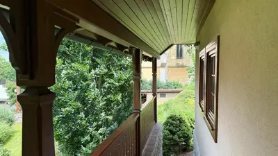 a balcony of a house with a view of a tree at Křivoklátské Johnyho bydlení in Křivoklát
