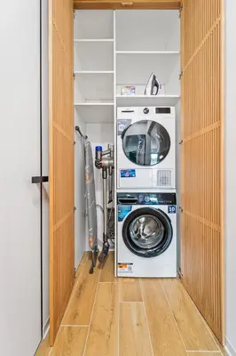 a laundry room with a washer and dryer at Karlín Diamond View & Garage in Prague
