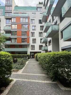 a walkway in front of a tall building at Karlín Diamond View & Garage in Prague