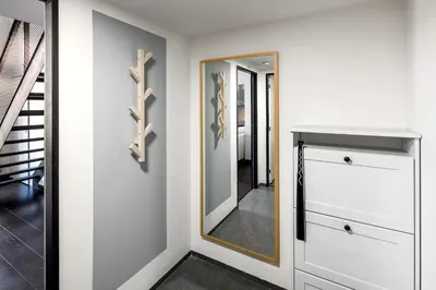 a white bathroom with a toilet and a sink at Family apartments with balcony in center of Prague in Prague