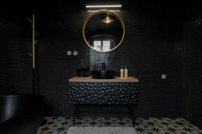 a black bathroom with a sink and a mirror at Kaple Jinak in Vrchovany