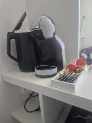 a coffee maker sitting on a counter next to a coffee maker at Vilda's Nest by Renka & Tom in Prague
