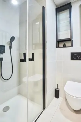 a bathroom with a shower and a toilet at Vilda's Nest by Renka & Tom in Prague