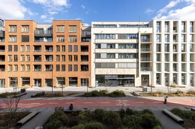 a group of buildings in front of a courtyard at Elegant Prague Flat with Balcony, Workspace, Garage in Prague