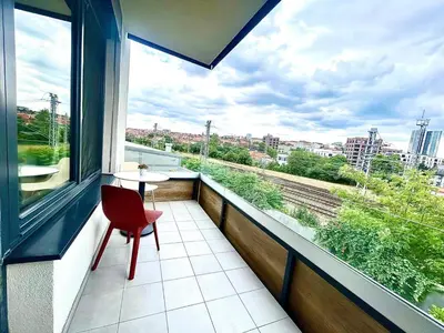 a kitchen with a sink and a counter top at Bright Apartment - Na Vinici Prague 2 in Prague