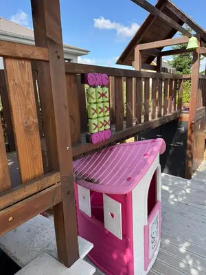 a pink and white dog house on a deck at Luxury Prague House in Herink