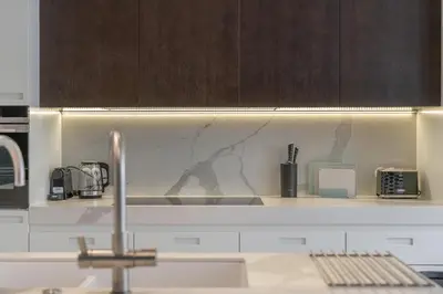 a kitchen with a counter top with a sink at Luxury Old Town Penthouse w park in Prague