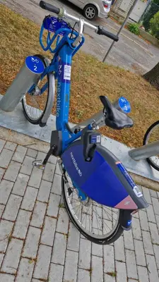 a blue bike is parked on a sidewalk at Apartmán ANNA