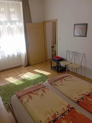 a room with two carpets on the floor and a door at Bright and cozy - 3 min to Old town square in Prague