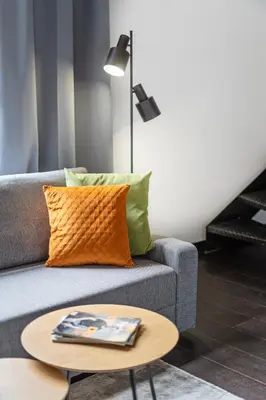 a living room with a couch and a table at Loft cozy studios in Prague Center in Prague
