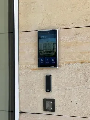 a cell phone on the side of a building at Cozy studio in centre of prague 10 Vrsovice in Prague
