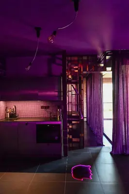a kitchen with purple ceilings and a kitchen with a ladder at Apartman made by David Černý in Prague