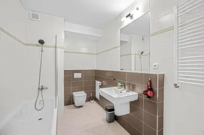 a bathroom with a sink and a toilet and a shower at New cozy apartment, Free Parking! in Prague