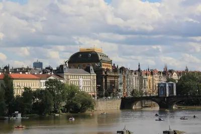 a city with a bridge over a river and buildings at New cozy apartment, Free Parking! in Prague