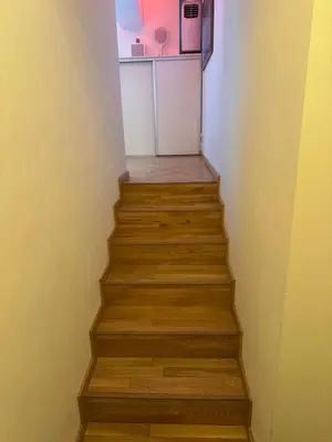 a stairway with a refrigerator and a microwave at LublaDeluxe in Prague