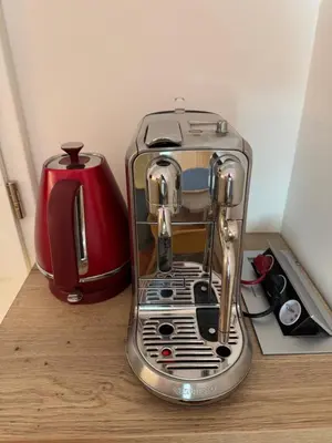 a silver toaster sitting on top of a counter at LublaDeluxe in Prague