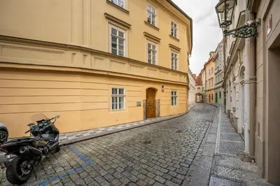 a motorcycle parked on a street next to a building at Cozy apartment in the Old town in Prague