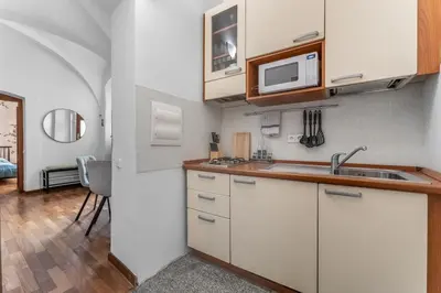 a kitchen with a sink and a microwave at Cozy apartment in the Old town in Prague