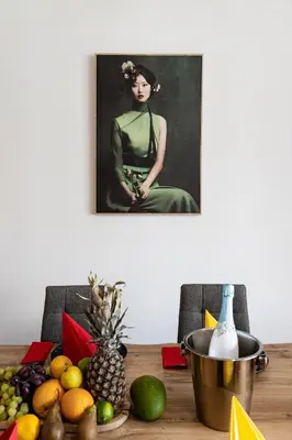 a painting of a woman sitting on a table with fruit at Bright Royal Elegance in Prague
