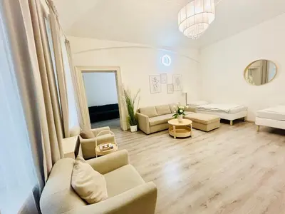 a living room with two couches and a couch at Elegant Cozy Apartment In center Prague in Prague