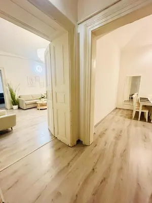 an empty living room with an open door at Elegant Cozy Apartment In center Prague in Prague
