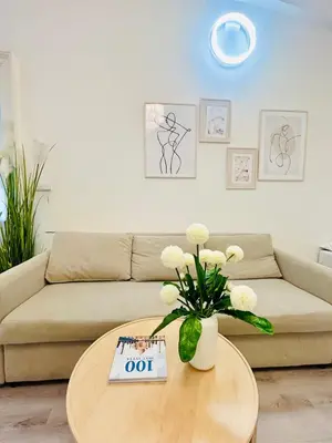 a living room with a couch and a table at Elegant Cozy Apartment In center Prague in Prague