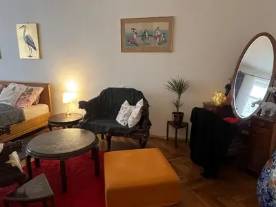 a living room with a couch and a chair at Štěpánká - Lucerna 1 in Prague