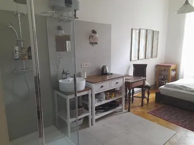 a bathroom with a sink and a shower at Newly Refurbished Self-contained Cosy Room in Prague