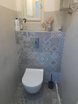 a bathroom with a white toilet and a sink at Newly Refurbished Self-contained Cosy Room in Prague