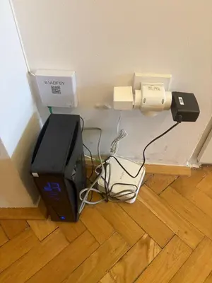 a computer monitor sitting on the floor in a room at A beautiful cozy room in Prague in Prague