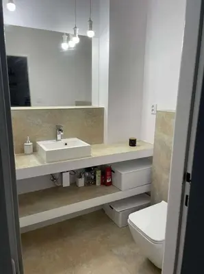 a bathroom with a sink and a toilet and a mirror at A beautiful cozy room in Prague in Prague