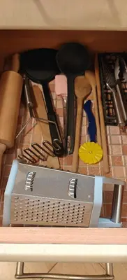 a drawer full of kitchen utensils on a table at Apartmán v Královském Údolí s předzahrádkou in Králŭv Dvŭr