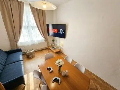 a bathroom with a sink and a bath tub at Apartment Paulie 3min to Metro Near O2 Arena and City Centre in Prague